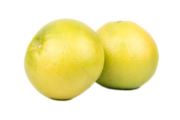 Two ripe fruit Oroblanco sweetie on a white background
