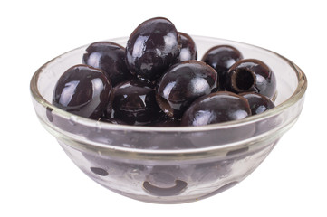 black olives in a clear glass bowl