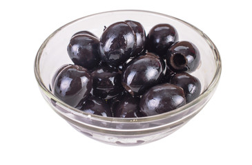 black olives in a transparent glass bowl with angle