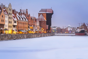 Old town of Gdansk at Motlawa river in snowy winter, Poland