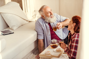 Mature couple drinking tea