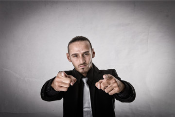 man indicated with fingers up