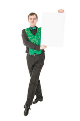 Young man in costume for irish dance with empty banner