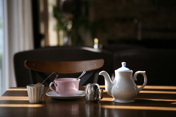 pink cup and white teapot