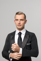 handsome businessman in fashionable suit in studio
