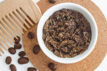 Homemade sugar and ground coffee face (body) scrub and wooden hair comb. DIY cosmetics