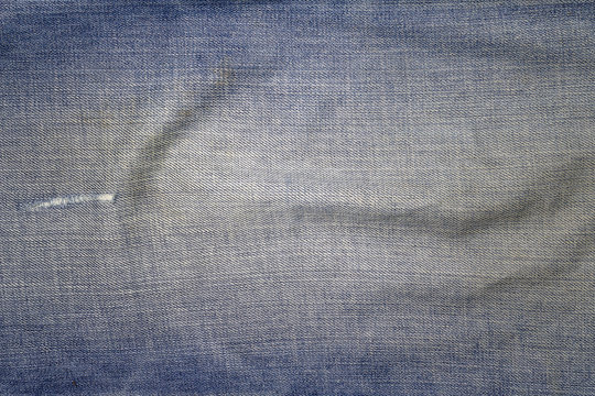 Texture of blue jeans textile background