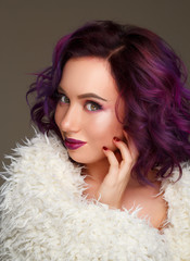Portrait of beautiful sexy fashion model with purple hair over g