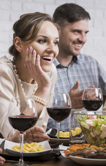Smiling couple sitting at the table