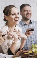 Cheerful couple enjoying family dinner