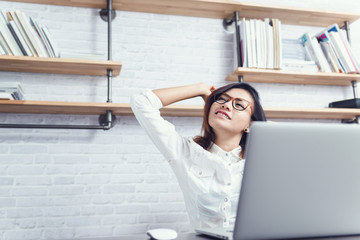 Asian women are happy with their work.focus on face.