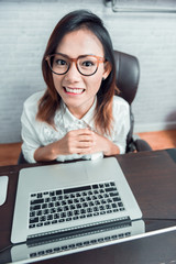 Photos of Asian women who are happy with their work at home,Focu