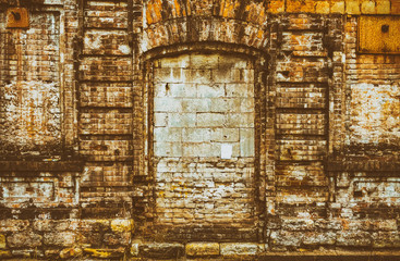 Brick wall of an old house, abstract retro, gloomy