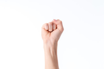 woman's hand with a clenched fist fingers isolated on white background
