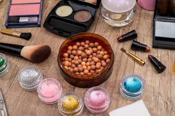 cosmetics set on wooden table top view.