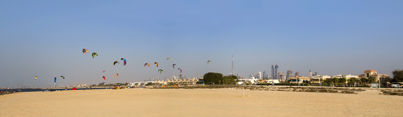 Fototapeta na wymiar Dubai beach kitesurfing and skyline panorama