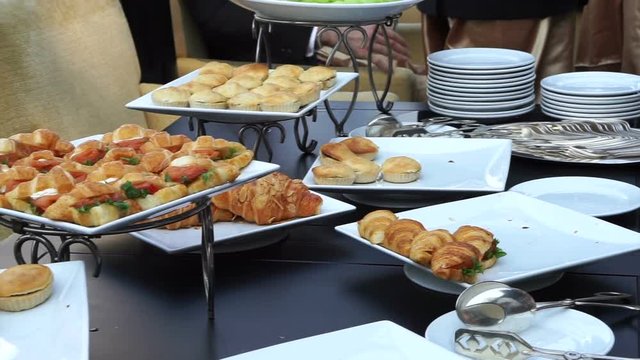 Assortment Sandwiches buffet, wedding reception. Light meal food, croissants and breads