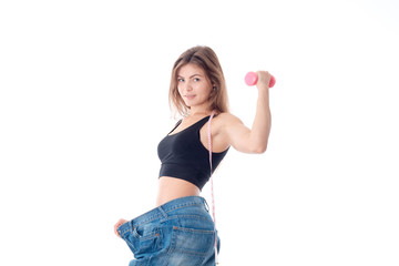 Sports girl wore slacks and shows the biceps on hand isolated  white background