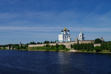 Fototapeta na wymiar View of Trinity Cathedral, the bell tower and the walls and tower of Pskov Kremlin. Pskov, Russia