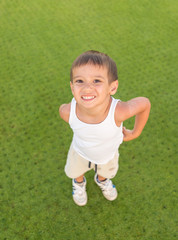 Kid on green grass