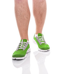 Men's sports legs in sneakers.