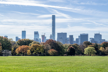Fototapeta na wymiar Great lawn located in the heart of Central Park during the fall