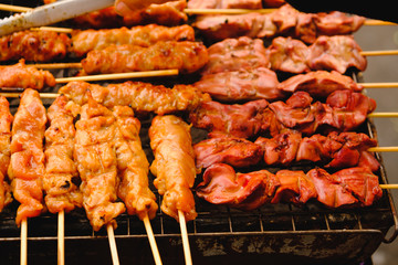 Vendor selling roasted pork thai style local market at Street food in Bangkok , Asia , Thailand