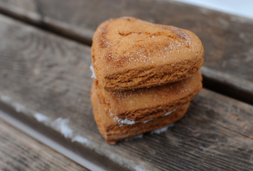 Homemade cookies with cinnamon  over wooden background