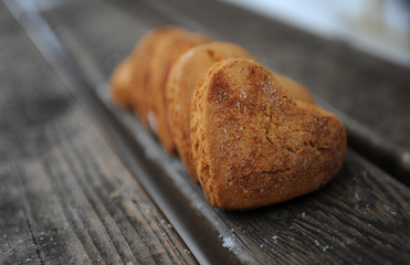 Homemade cookies with cinnamon  over wooden background
