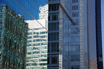 Midtown Manhattan NYC intersecting high-rise buildings architectural background reflections