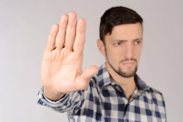 Man doing stop gesture.