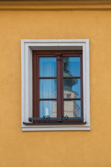 Fototapeta na wymiar Reflection of a church tower in the window
