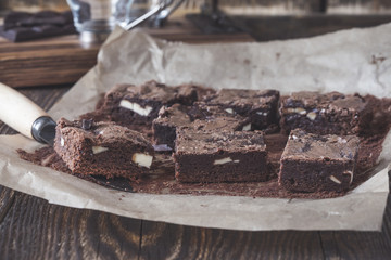 Dark chocolate brownies with cream cheese on baking paper