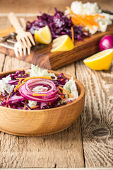 Fototapeta na wymiar Chinese cabbage salad with red cabbage, carrot and red onion