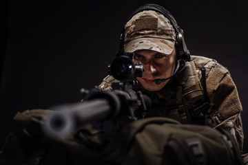 military contractor with his sniper rifle at night. war, army - obrazy, fototapety, plakaty