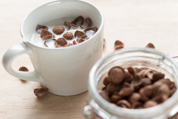 chocolate cereal cornflakes and milk for breafast