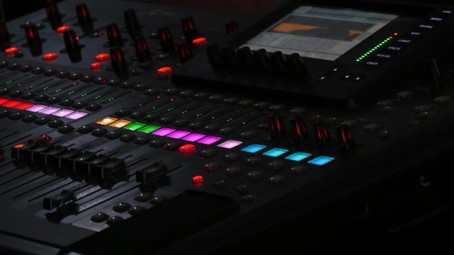 Sound mixer console during a concert, audio mixer