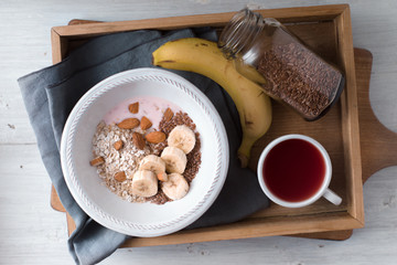 Healthy breakfast on the wooden tray  top view