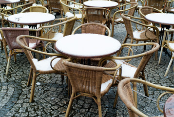 Fototapeta na wymiar Bistro tables covered with snow