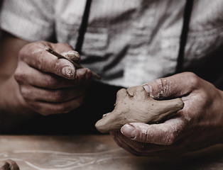 hands working with clay