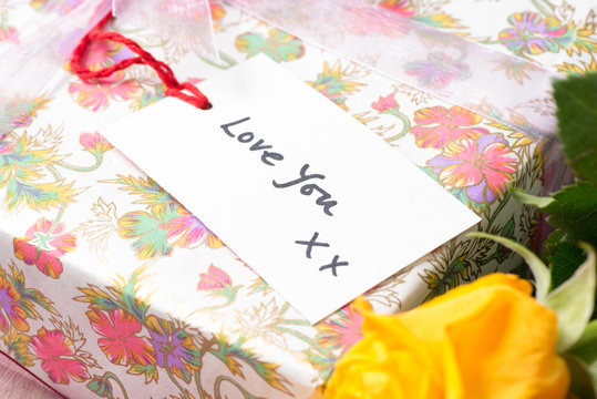 Gift Tag with the Words "Love You" on Wrapped Present