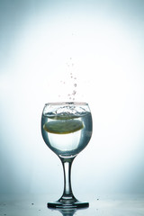 slice of lemon drops in a glass of water
