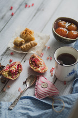 tea, fruit, fabric on wooden background