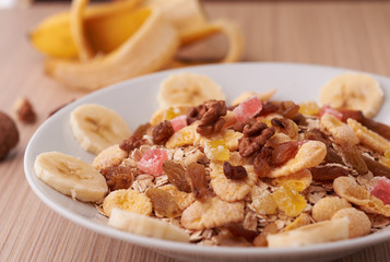 flakes with dried fruit, granola on the plate