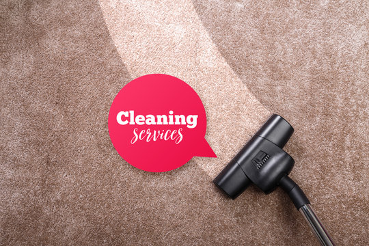 Vacuuming carpet with vacuum cleaner. Cleaning services speech bubble. Housework service. Close up of the head of a sweeper cleaning device.