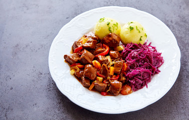 Herbed potato dumplings served with spicy beef