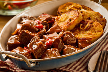 Rich beef goulash with crispy roasted dumplings