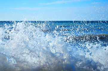 Waves rolled on the rocky coast
