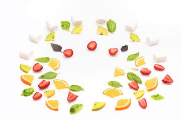 strawberry, green mint leaves and orange isolated on white