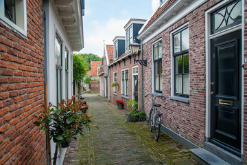 Passage between houses with bicycle